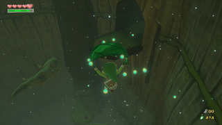 Use the Deku Leaf to fly up to the top of the second room.