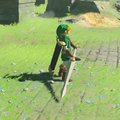 Link holding Biggoron's Sword while wearing the Hero of Time Set in Breath of the Wild