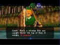 Link with the Hylian Loach in hand in Ocarina of Time